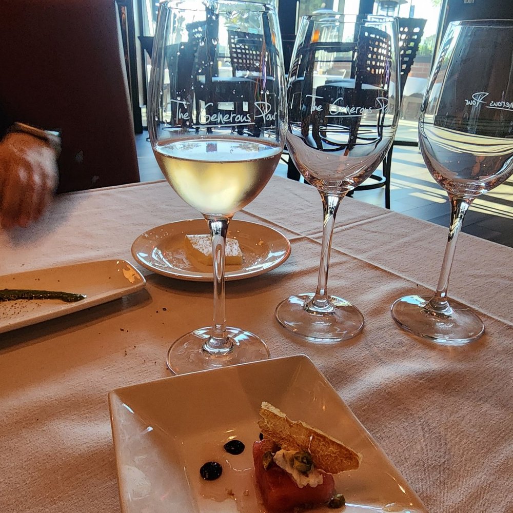 Amuse bouche of watermelon with prosciutto chip Amuse bouche of watermelon with prosciutto chip