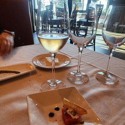 Amuse bouche of watermelon with prosciutto chip