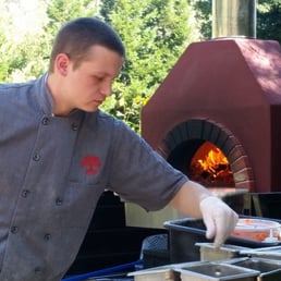 Wonderful cook making the pizza Wonderful cook making the pizza