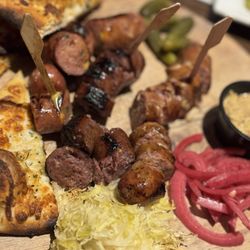 Wyoming Ale Works - The Bovine & Swine Sausage Board with burnt bread and no cheese.