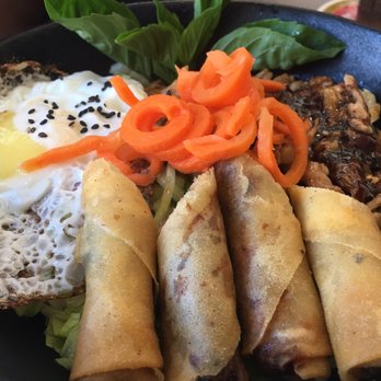 NAM Vietnamese Kitchen - Chicken satay rice bowl with fried egg and spring rolls - Vietnamese Near Me - Calgary, Alberta NAM Vietnamese Kitchen - Chicken satay rice bowl with fried egg and spring rolls - Vietnamese Near Me - Calgary, Alberta