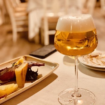 Sky Blu - The draft beer was served in a stemmed glass. Rack of lamb with potatoes. Delicious - Lounges Near Me - Rome, RM Sky Blu - The draft beer was served in a stemmed glass. Rack of lamb with potatoes. Delicious - Lounges Near Me - Rome, RM