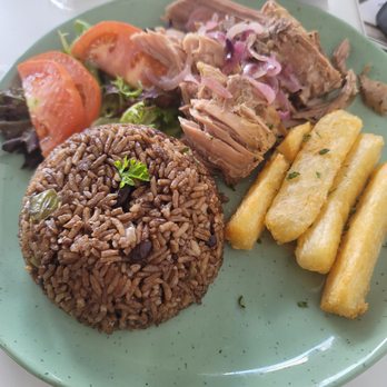 1928 Cuban Bistro - St. Johns  - Roast pork with Congri rice and Yucca Fries and salad - Cuban Near Me - Saint Johns, Florida