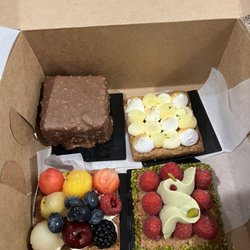 Le Carré Café & Pâtisserie - Rocher, white chocolate meringue, pistachio raspberry and fruit tart
