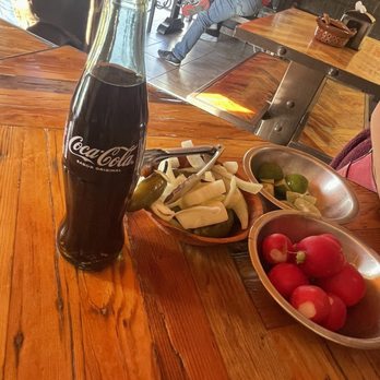 Tacos Los Amigos - Condiments with bottled coke - Tacos Near Me - Tecate, BCN Tacos Los Amigos - Condiments with bottled coke - Tacos Near Me - Tecate, BCN