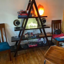 a triangle shelf with speakers a triangle shelf with speakers