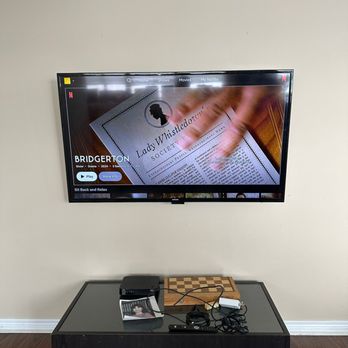 SetupTeam - TV wall mounting with level alignment secure bracket install and clean cable routing for streaming setup above media console in Oakville - TV Mounting Near Me - Toronto, Ontario SetupTeam - TV wall mounting with level alignment secure bracket install and clean cable routing for streaming setup above media console in Oakville - TV Mounting Near Me - Toronto, Ontario