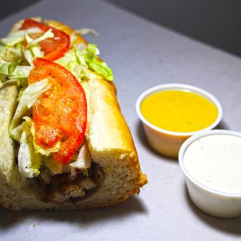 Capt'n Nemo's Sub Shop - a sub sandwich with lettuce, tomatoes, and onions - Sandwiches Near Me - Westland, Michigan Capt'n Nemo's Sub Shop - a sub sandwich with lettuce, tomatoes, and onions - Sandwiches Near Me - Westland, Michigan