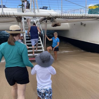 Teralani Sailing Adventures - Boarding the catamaran from the beach was fun. - Boating Near Me - Lahaina, Hawaii
