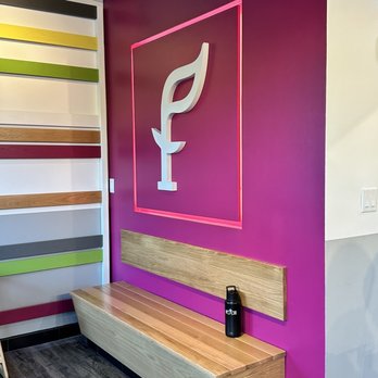 SoFresh - a wooden bench in front of a colorful wall - New American Near Me - Fort Lauderdale, Florida