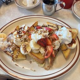 French toast special. Comes with bananas, strawberries, walnuts, whipped cream, and chocolate sauce. Absolutely delicious! French toast special. Comes with bananas, strawberries, walnuts, whipped cream, and chocolate sauce. Absolutely delicious!
