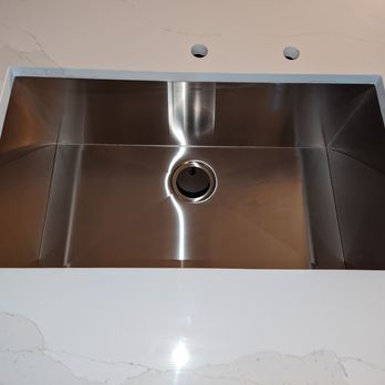 KJ Natural Stone - They hooked it up with an awesome stainless steel undermount sink as well (installers did a great job drilling holes for faucet/disposal) - Flooring Near Me - Raleigh, North Carolina