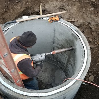 Quality Backhoe Services - Installing a grinder pump for a sewage system in Walla Walla, WA - Excavation Services Near Me