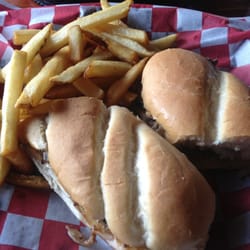 Office Pub & Steakhouse - Philly steak with onions peppers and fries on the side