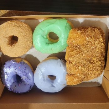 SloDoCo Donuts - Ube-deep purple, lavender-light purple. green-mint, and a snickerdoodle donut. Apple cinnamon crumb bear claw. - Donuts Near Me - San Luis Obispo, California