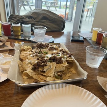 Grist Iron Brewing - Flight of drinks, and pulled pork nachos - Breweries Near Me - Burdett, New York