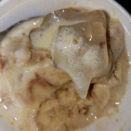 Ice chunk scooped into a small banana fudge ice by the staff.