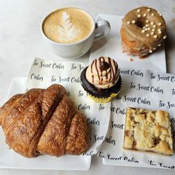 Too Sweet Cakes - Maple Croissant Doughnut, Ham & Swiss Croissant, Salted Caramel Bar, Chocolate Peanut Butter Cupcake, and a Vanilla Latte