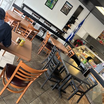 El Sabor de El Salvador - a man sitting at a table in a restaurant - Salvadoran Near Me - Fullerton, California El Sabor de El Salvador - a man sitting at a table in a restaurant - Salvadoran Near Me - Fullerton, California