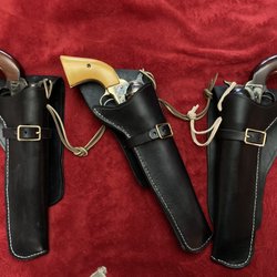 Zack White Leather Co - Set of holsters for Colt "clone" open-top revolvers.  Cross-draw holster in the middle