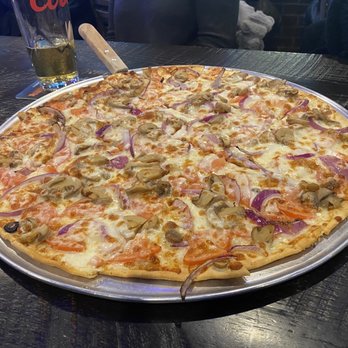 Home Plate Bar & Grill - a pizza on a table - Sports Bars Near Me - Springfield, Illinois Home Plate Bar & Grill - a pizza on a table - Sports Bars Near Me - Springfield, Illinois
