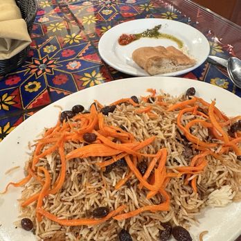 Khyber Pass Kabob - Lamb shank buried in the bed of rice with bread on the side - Afghan Near Me - Dublin, California Khyber Pass Kabob - Lamb shank buried in the bed of rice with bread on the side - Afghan Near Me - Dublin, California