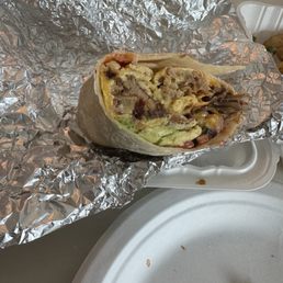 Carnitas omelette that I put into a tortilla at home. Carnitas omelette that I put into a tortilla at home.