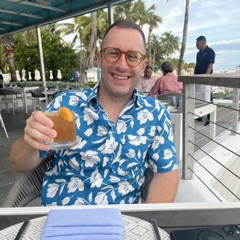 Four Marlins Oceanfront Dining - Can kind of see the beach behind the hubby! - Seafood Near Me - Key West, Florida