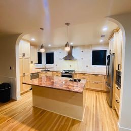a kitchen with a center island a kitchen with a center island