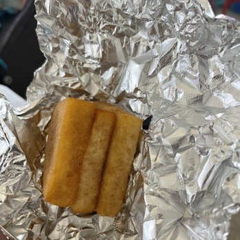 Islanders Jerk - a person holding a piece of food wrapped in tin foil - Food Trucks Near Me - Hollywood, Florida Islanders Jerk - a person holding a piece of food wrapped in tin foil - Food Trucks Near Me - Hollywood, Florida
