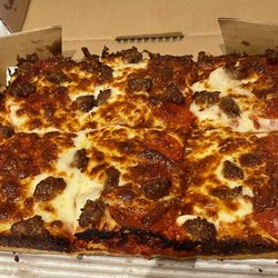 Blackjack Pizza - We liked it. Deep dish w/ pep, sausage, xtra cheese & sauce