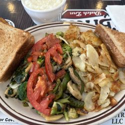 Britt's Dutch Inn - Vegan version of veggie omelette and home fries. Made oil free so heart healthy! Plain grits were perfect too.