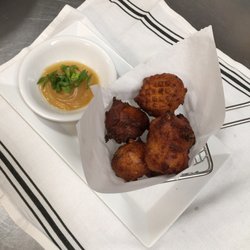 Tap & Vine - Jalapeño corn hushpuppies with honey butter.