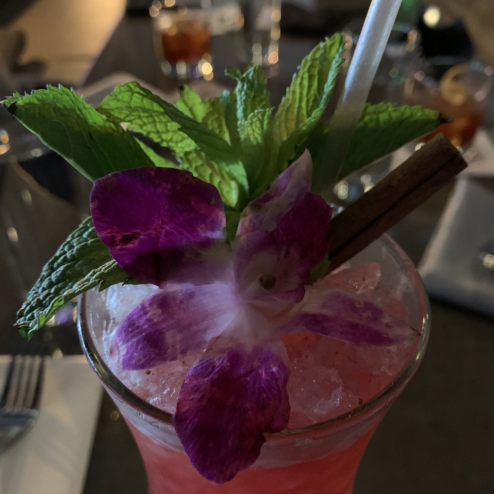 Under Current - Garnish on the Zombie -- fresh mint, a hibiscus, grated cinnamon, and a cinnamon stick. Lovely aroma, great taste! - Cocktail Bars Near Me - Salt Lake City, Utah Under Current - Garnish on the Zombie -- fresh mint, a hibiscus, grated cinnamon, and a cinnamon stick. Lovely aroma, great taste! - Cocktail Bars Near Me - Salt Lake City, Utah