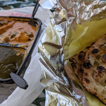 Masala House Restaurant - Two items combo with rice, chili garlic naan upgrade, and mango lasse drink - Indian Near Me - Corona, California Masala House Restaurant - Two items combo with rice, chili garlic naan upgrade, and mango lasse drink - Indian Near Me - Corona, California