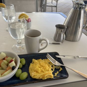 Ilios - Scrambled eggs with fruit bowl and coffee - New American Near Me - Fort Lauderdale, Florida Ilios - Scrambled eggs with fruit bowl and coffee - New American Near Me - Fort Lauderdale, Florida