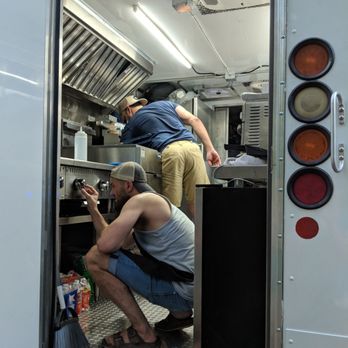 Ducrés - two men working on a food truck - Food Trucks Near Me Ducrés - two men working on a food truck - Food Trucks Near Me