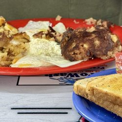 Corned Beef Hash platter with home fries and three eggs
