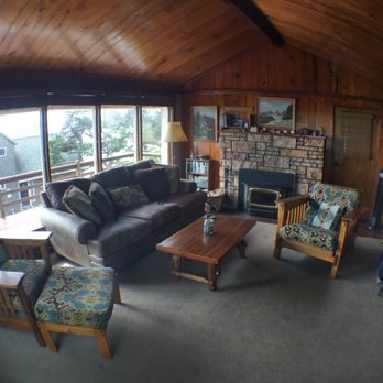 Knotty Pine Ocean View Cabin - Living room of the Knotty Pine. Fireplace is ready to go. Looking forward to a great sunset! - Guest Houses Near Me - Oceanside, Oregon