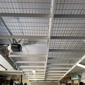 Good Garage - Worked around obstacles like garage door openers to fit as many racks as they could. - Home Organization Near Me