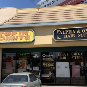 Stop In Donuts - a car parked in front of a donut shop - Donuts Near Me - Van Nuys, California