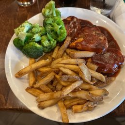 Bbq chicken breast special with steamed 'vegetables' and french fries.