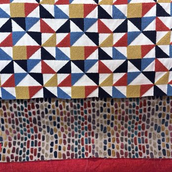 Boca Bargoons Decorative Fabric Outlet - Reds/oranges display section at store front - Fabric Stores Near Me - Jacksonville, Florida