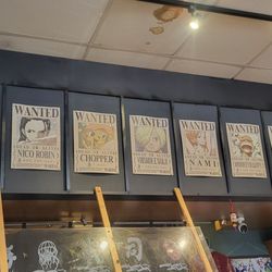Misako - Anime posters and video screen above the bar