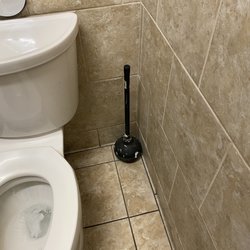Hobby Lobby - Black grout. The plunger says more then I want to know about what happened in this stall. I definitely went home and showered.
