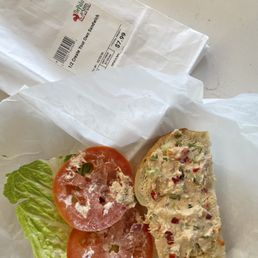 a "half sandwich" with about a tablespoon of tuna salad. Not even enough to spread over the piece of bread. a "half sandwich" with about a tablespoon of tuna salad. Not even enough to spread over the piece of bread.