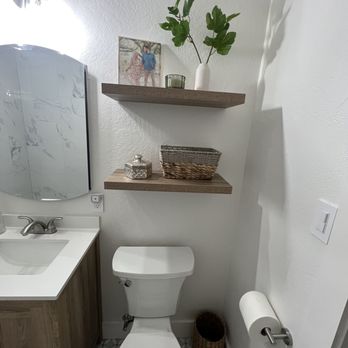 JR&G Construction - a white toilet in a bathroom - General Contractors Near Me
