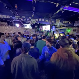 a crowd of people in a bar