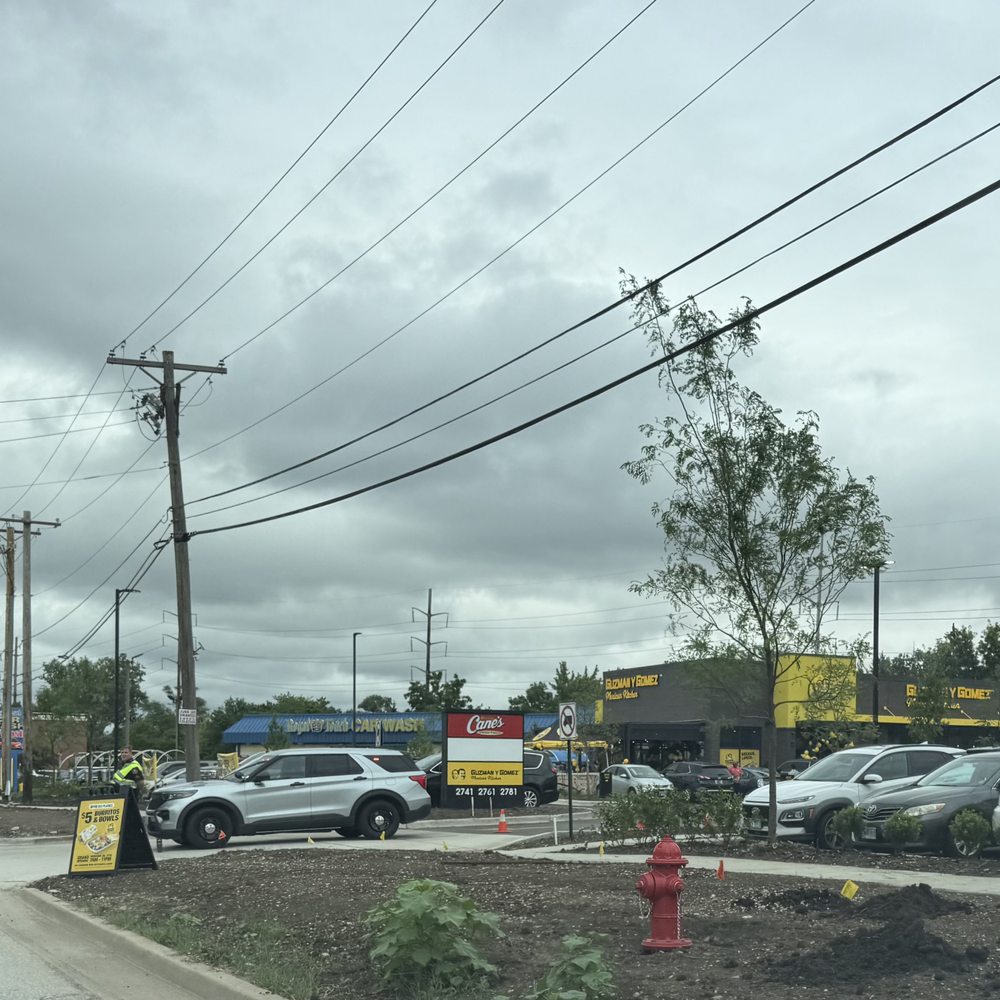 Guzman y Gomez - Police directing traffic, and their signage and storefront on grand opening day. - Mexican Near Me - Des Plaines, Illinois Guzman y Gomez - Police directing traffic, and their signage and storefront on grand opening day. - Mexican Near Me - Des Plaines, Illinois