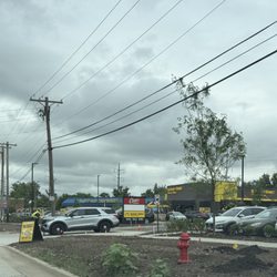 Guzman y Gomez - Police directing traffic, and their signage and storefront on grand opening day.